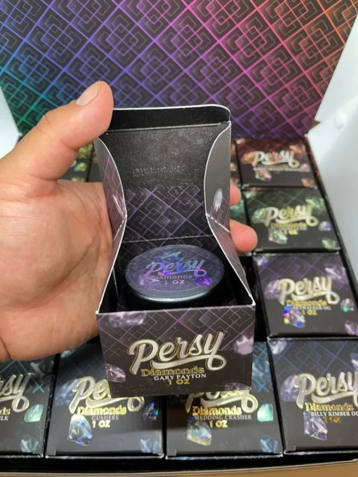 Persy Diamonds Wax 1OZ Jars Baller Box The  epitome of cannabis luxury with Persy Diamonds by 710 Labs. Crafted with precision and passion, Persy Diamonds redefine the standard for cannabis concentrates, delivering an experience that is unparalleled in purity, potency, and flavor. Elevate your senses and indulge in the brilliance of Persy Diamonds, where every puff is a journey to pure euphoria. Key Features of Persy Diamonds: Unmatched Purity: Persy Diamonds are crafted using the finest cannabis flower, meticulously selected for its quality and potency. Through a proprietary extraction process, 710 Labs extracts the purest cannabinoids and terpenes, resulting in concentrates of unparalleled purity. Spectacular Clarity: True to their name, Persy Diamonds dazzle with their crystal-clear appearance. Each diamond-shaped concentrate glistens with brilliance, reflecting the care and precision that goes into its creation. Potent Effects: Prepare for an unforgettable experience as Persy Diamonds deliver potent effects that are both uplifting and euphoric. Whether you’re seeking creative inspiration or relaxation, Persy Diamonds offer a journey to new heights of bliss. Exquisite Flavor Profiles: Indulge your palate with Persy Diamonds’ exquisite flavor profiles, each one a testament to the unique characteristics of the strain from which it was derived. From fruity to floral, spicy to earthy, there’s a Persy Diamond to tantalize every taste bud. Versatile Consumption: Whether dabbed, vaporized, or added to flower, Persy Diamonds offer versatility in consumption, allowing you to customize your experience according to your preferences and mood. Why Choose Persy Diamonds? Crafted with precision and passion by 710 Labs, Persy Diamonds are a testament to excellence in cannabis extraction. Experience the pinnacle of purity, potency, and flavor with Persy Diamonds, where every puff is a journey to pure euphoria. Elevate your cannabis experience to new heights with Persy Diamonds, the ultimate expression of cannabis luxury. Persy Diamonds: Elevate your cannabis experience and indulge in the brilliance of Persy Diamonds by 710 Labs. Whether you’re a seasoned connoisseur or new to concentrates, Persy Diamonds offer a premium experience that is sure to impress. Try Persy Diamonds today and discover a new standard of excellence in cannabis concentrates. Persy Diamonds Wax